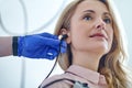 Tranquil patient undergoing an audiometry test performed by an audiologist