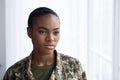 Closeup Portrait Of Serious Black Female Soldier Standing Near Window Indoors Royalty Free Stock Photo