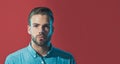 Closeup portrait of serious fashionable bearded man with stylish hairstyle in denim shirt. Sexy handsome male model with Royalty Free Stock Photo