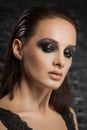 Closeup portrait of a serious lady with smoky eye makeup Royalty Free Stock Photo