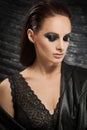 Closeup portrait of a serious lady with smoky eye makeup Royalty Free Stock Photo