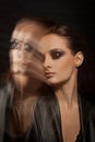 Closeup portrait of a serious lady with smoky eye makeup Royalty Free Stock Photo