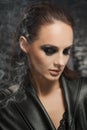 Closeup portrait of a serious lady with smoky eye makeup Royalty Free Stock Photo