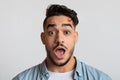 Closeup portrait of shocked young arab man looking at camera with astonishment Royalty Free Stock Photo