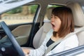 Closeup portrait sleepy, yawn, close eyes young woman driving he