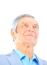 Closeup portrait of a smart senior man smiling on white background Royalty Free Stock Photo