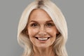 Closeup Portrait Of Smiling Attractive Mature Woman With Blonde Hair Royalty Free Stock Photo