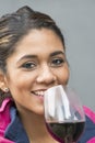 Closeup portrait of smiling beautiful woman with red wine glass. Royalty Free Stock Photo