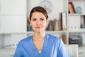 Closeup portrait of smiling female health worker in office Royalty Free Stock Photo