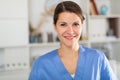 Closeup portrait of smiling female health worker in office Royalty Free Stock Photo