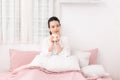 Closeup portrait of smiling girl enjoying her drink while relaxing at home Royalty Free Stock Photo