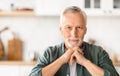 Closeup Portrait Of Smiling Grey-Haired Man Posing in Kitchen Interior, Royalty Free Stock Photo