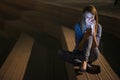 Closeup portrait smiling or laughing young freelancer woman looking at phone seeing good news or photos with nice emotion Royalty Free Stock Photo