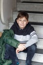 Closeup portrait of smiling smart school boy indoors. Happy teen child at home. Teenager looking at camera. Education Royalty Free Stock Photo