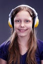 Closeup portrait of a smiling teen girl with headphones Royalty Free Stock Photo