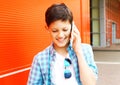 closeup portrait smiling teenager boy talks on smartphone Royalty Free Stock Photo