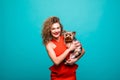 Closeup portrait of smiling young attractive woman looking at camera and embracing Yorkshire terrier. Pet concept. Isolated front Royalty Free Stock Photo