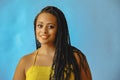 closeup portrait of smiling young beautiful african american woman braid hair posing at studio looking at camera Royalty Free Stock Photo