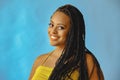closeup portrait of smiling young beautiful african american woman braid hair posing at studio looking at camera Royalty Free Stock Photo