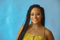 closeup portrait of smiling young beautiful african american woman braid hair posing at studio looking at camera Royalty Free Stock Photo