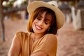 Closeup portrait of smiling young latino woman at the beach