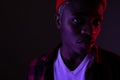 Closeup portrait of a stylish handsome african black man in neon light Royalty Free Stock Photo