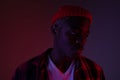 Closeup portrait of a stylish handsome african black man in neon light Royalty Free Stock Photo