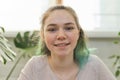 Closeup portrait of talking teenage girl looking at video camera