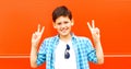 closeup portrait teenager boy is having fun on a colorful orange Royalty Free Stock Photo