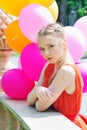 Closeup portrait of tender teenager with balloons