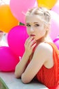 Closeup portrait of tender teenager with balloons