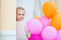 Closeup portrait of tender young woman with balloons