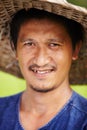 Closeup portrait of a Thai rice paddy worker wearing a traditional hat Royalty Free Stock Photo