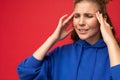 Closeup portrait of tired weary young attractive blonde woman with two horns with sincere emotions wearing stylish