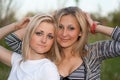 Closeup portrait of two attractive young women Royalty Free Stock Photo