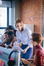 Closeup portrait of two female executives working with paper in the loft office Royalty Free Stock Photo