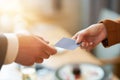 Closeup portrait of two successful business executive exchanging business card