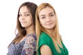 Closeup portrait of two teenage girls standing back to back Royalty Free Stock Photo