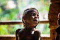 Closeup Portrait of unidentified Papuan little boy of Korowai tribe in the jungle of New Guinea.