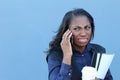 Closeup portrait upset sad, skeptical, unhappy, serious African woman talking on phone. Negative human emotion facial expression Royalty Free Stock Photo