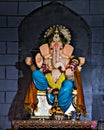 Closeup , portrait view of decorated and garlanded idol of Hindu God Ganesha in Pune ,Maharashtra, India.
