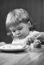 Small boy eating porridge Royalty Free Stock Photo
