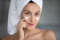 Closeup portrait woman applying night or day face cream Royalty Free Stock Photo