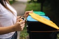 Closeup portrait woman hand throwing empty plastic water bottle in recycling bin Royalty Free Stock Photo