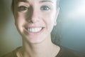 Closeup portrait of a woman and her clean and beutiful smile showing the white teeth