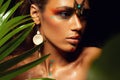 Closeup portrait of woman tanned skin colored makeup tropical jungle paint on the face sweat plant palm leaves wild style exotic