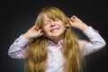 Closeup portrait of worried girl covering her ears, observing. Hear nothing. Human emotions, facial expressions Royalty Free Stock Photo