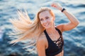 Closeup portrait of young active woman smiling on beach Royalty Free Stock Photo