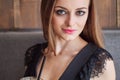 Closeup portrait of young adorable woman with gorgeous eyes trendy makeup drinking big glass cup of coffee with straw Royalty Free Stock Photo