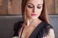 Closeup portrait of young adorable woman with gorgeous eyes trendy makeup drinking big glass cup of coffee with straw Royalty Free Stock Photo